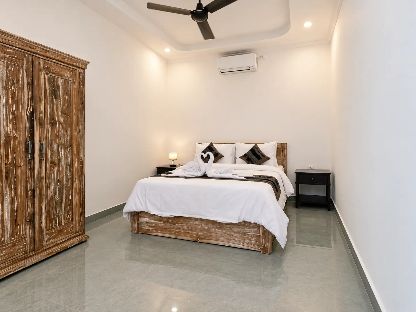 Villa 2 — Second bedroom with wardrobe and ceiling fan